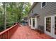 Spacious deck with red wooden flooring, offering a relaxing outdoor space at 4698 Norman Nw Dr, Kennesaw, GA 30144