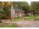 Two-story house with a red brick facade and a side driveway at 4698 Norman Nw Dr, Kennesaw, GA 30144