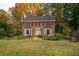 Brick two-story house with shutters, stone walkway, and lush lawn at 4698 Norman Nw Dr, Kennesaw, GA 30144