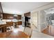 Kitchen with island, wood cabinets, and view into entryway at 4698 Norman Nw Dr, Kennesaw, GA 30144