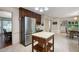 Eat-in kitchen with island and stainless steel refrigerator at 4698 Norman Nw Dr, Kennesaw, GA 30144