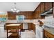 Spacious kitchen with wooden cabinets, granite counters and island at 4698 Norman Nw Dr, Kennesaw, GA 30144