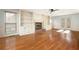 Bright living room with hardwood floors, fireplace, and built-in shelving at 4698 Norman Nw Dr, Kennesaw, GA 30144