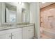 Bathroom with double vanity and a shower/tub combo at 93 Carriage Lake Dr, Stockbridge, GA 30281