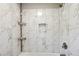 Clean bathroom with shower and marble tile at 93 Carriage Lake Dr, Stockbridge, GA 30281