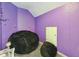 Cozy bedroom with purple walls, beanbag chairs, and string lights at 93 Carriage Lake Dr, Stockbridge, GA 30281