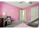 Pink bedroom with a bunk bed and play area at 93 Carriage Lake Dr, Stockbridge, GA 30281