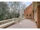 Spacious deck overlooks wooded area, offering peaceful outdoor space at 1000 Riverside Rd, Roswell, GA 30076