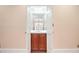 Small powder room with a wooden vanity and mirrored doors at 1000 Riverside Rd, Roswell, GA 30076