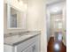 Bathroom featuring granite countertops and a large mirror over the vanity at 2355 Henderson Mill Ne Rd # 6, Atlanta, GA 30345