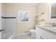 Bathroom featuring a tub with tiled walls, granite countertops, and neutral paint at 2355 Henderson Mill Ne Rd # 6, Atlanta, GA 30345