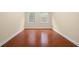Empty bedroom with hardwood floors, two windows, and neutral paint at 2355 Henderson Mill Ne Rd # 6, Atlanta, GA 30345