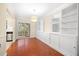 Bright dining room featuring hardwood floors and built in cabinets with glass doors at 2355 Henderson Mill Ne Rd # 6, Atlanta, GA 30345