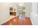 Bright dining room with hardwood floors and built-in shelving, adjacent to kitchen at 2355 Henderson Mill Ne Rd # 6, Atlanta, GA 30345