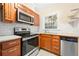Updated kitchen features stainless steel appliances, granite countertops, and wood cabinets at 2355 Henderson Mill Ne Rd # 6, Atlanta, GA 30345