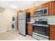 The kitchen includes stainless steel appliances and a stackable washer and dryer at 2355 Henderson Mill Ne Rd # 6, Atlanta, GA 30345