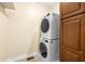 The modern laundry room boasts a stackable washer and dryer at 2355 Henderson Mill Ne Rd # 6, Atlanta, GA 30345