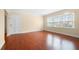 Bright living room features hardwood floors and large windows that provide ample natural light at 2355 Henderson Mill Ne Rd # 6, Atlanta, GA 30345