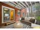 Cozy, furnished enclosed patio with brick accents and outdoor seating area at 2355 Henderson Mill Ne Rd # 6, Atlanta, GA 30345