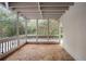 Inviting screened porch with wooded views, perfect for relaxing in a serene outdoor setting at 2355 Henderson Mill Ne Rd # 6, Atlanta, GA 30345