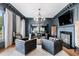 Dark-paneled bar area with leather seating and fireplace at 1445 Hillside Dr, Grayson, GA 30017