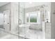 Spa-like bathroom with marble finishes, soaking tub and walk-in shower at 1445 Hillside Dr, Grayson, GA 30017