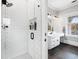 Modern bathroom with white subway tile shower and dark gray floor tile at 1445 Hillside Dr, Grayson, GA 30017