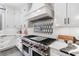 Modern kitchen with stainless steel appliances and custom backsplash at 1445 Hillside Dr, Grayson, GA 30017