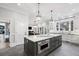 Modern kitchen with large island and dark gray cabinetry at 1445 Hillside Dr, Grayson, GA 30017