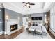 Main bedroom with fireplace, hardwood floors and natural light at 1445 Hillside Dr, Grayson, GA 30017