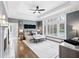 Serene main bedroom with gray walls, hardwood floors and large windows at 1445 Hillside Dr, Grayson, GA 30017