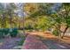 Brick pathway meanders through a colorful landscape at 1445 Hillside Dr, Grayson, GA 30017