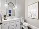 Stylish powder room with white vanity and modern fixtures at 1445 Hillside Dr, Grayson, GA 30017