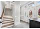 Bright and airy staircase with wooden treads and white risers at 1445 Hillside Dr, Grayson, GA 30017