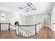 Light-filled upper landing overlooking the grand foyer and staircase at 1445 Hillside Dr, Grayson, GA 30017