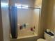 Bathroom with tub, shower, and toilet at 1753 Ridge Se Ct, Conyers, GA 30013