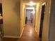 Long hallway with light walls and wood flooring at 1753 Ridge Se Ct, Conyers, GA 30013