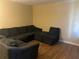 Living room featuring a large sectional sofa at 1753 Ridge Se Ct, Conyers, GA 30013