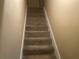 Carpeted staircase leading to the upper level at 1753 Ridge Se Ct, Conyers, GA 30013