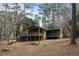 Spacious backyard with mature trees, deck, and screened-in porch at 2468 Ridgeway Dr, Atlanta, GA 30360