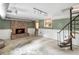 Basement area with brick fireplace, spiral staircase, and exposed ductwork at 2468 Ridgeway Dr, Atlanta, GA 30360