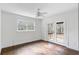 Bright bedroom with hardwood floors, a ceiling fan, and access to a screened porch at 2468 Ridgeway Dr, Atlanta, GA 30360