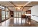 Bright, spacious dining area features a wood-paneled ceiling and fireplace, perfect for Gathering gatherings at 2468 Ridgeway Dr, Atlanta, GA 30360