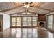 Bright dining area offering beautiful wood ceiling, stone fireplace, and hardwood floors at 2468 Ridgeway Dr, Atlanta, GA 30360