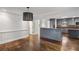 Spacious dining room with hardwood floors adjacent to the modern kitchen at 2468 Ridgeway Dr, Atlanta, GA 30360