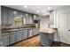 Kitchen with gray cabinetry, granite countertops, stainless steel appliances, and stylish backsplash at 2468 Ridgeway Dr, Atlanta, GA 30360