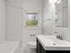 Clean bathroom, white subway tile, and dark vanity at 2488 Elizabeth Ann Ne Ln, Atlanta, GA 30324