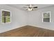 Light-filled bedroom featuring hardwood floors and window blinds at 2488 Elizabeth Ann Ne Ln, Atlanta, GA 30324