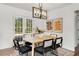 Charming dining room featuring a wood table and six black chairs at 2488 Elizabeth Ann Ne Ln, Atlanta, GA 30324