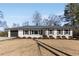 Ranch style home with white brick, black shutters, and a two-car garage at 2488 Elizabeth Ann Ne Ln, Atlanta, GA 30324